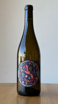 A bottle of Riesling wine with a colorful, artistic label designed by Julien Renard.